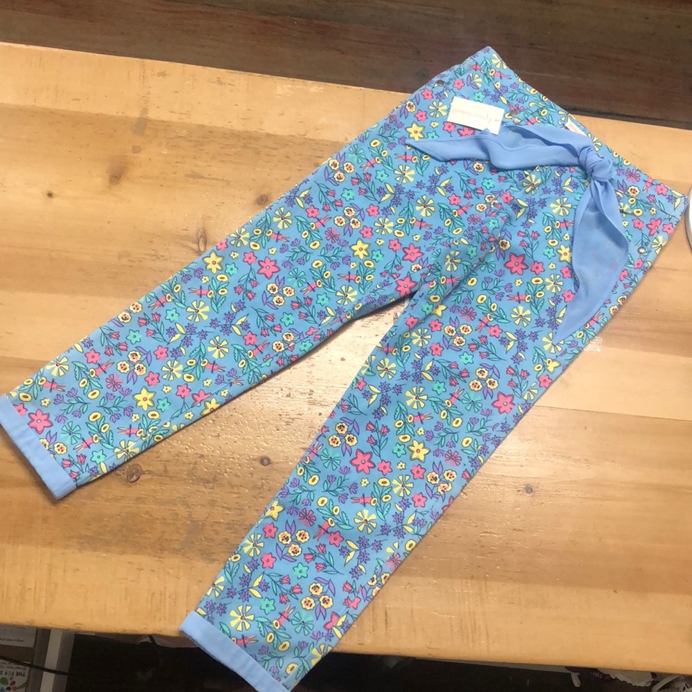 Girls flowered jeans.